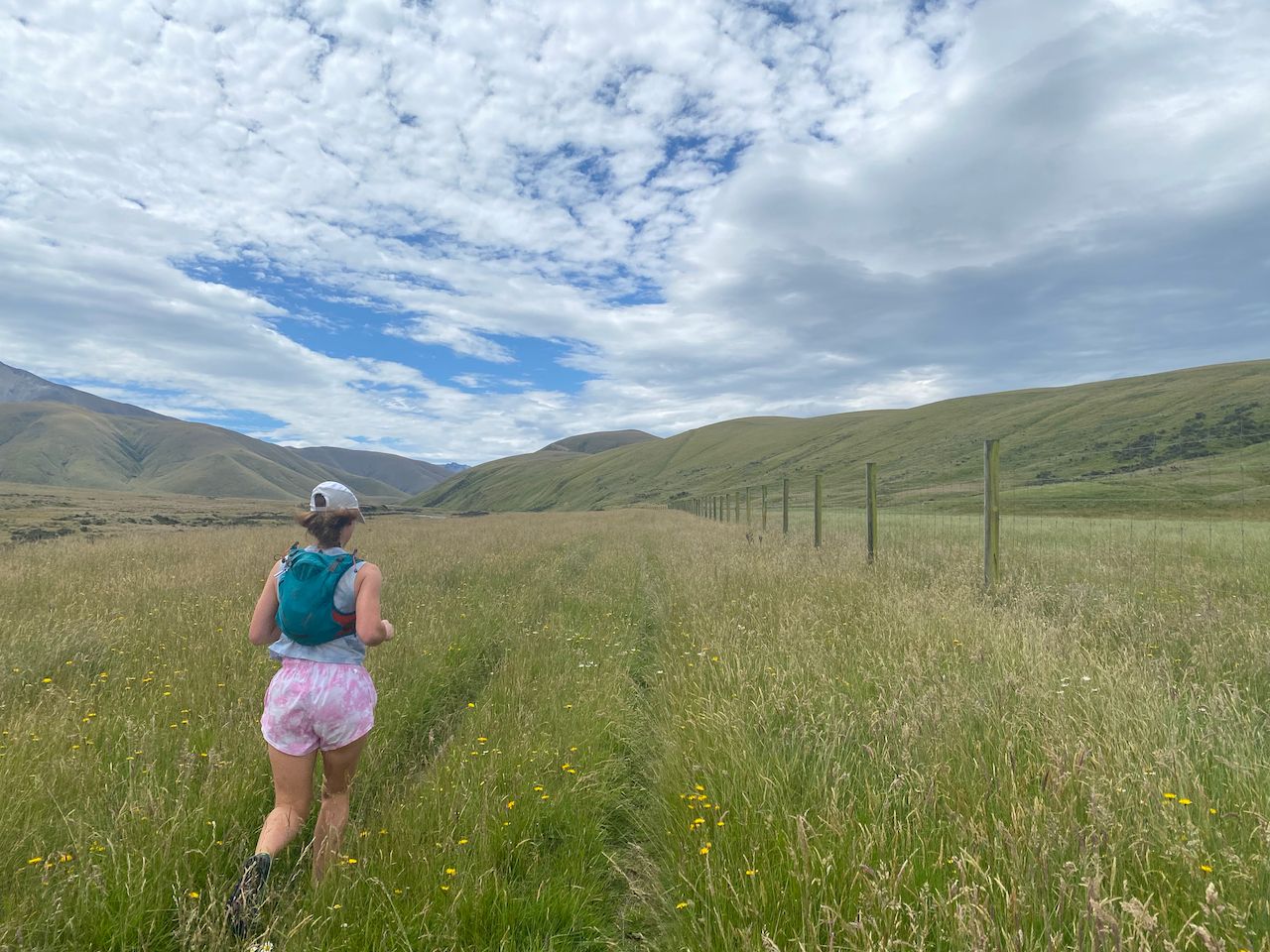 Jen following the 4WD track alongside the deer fence at the start of the track.