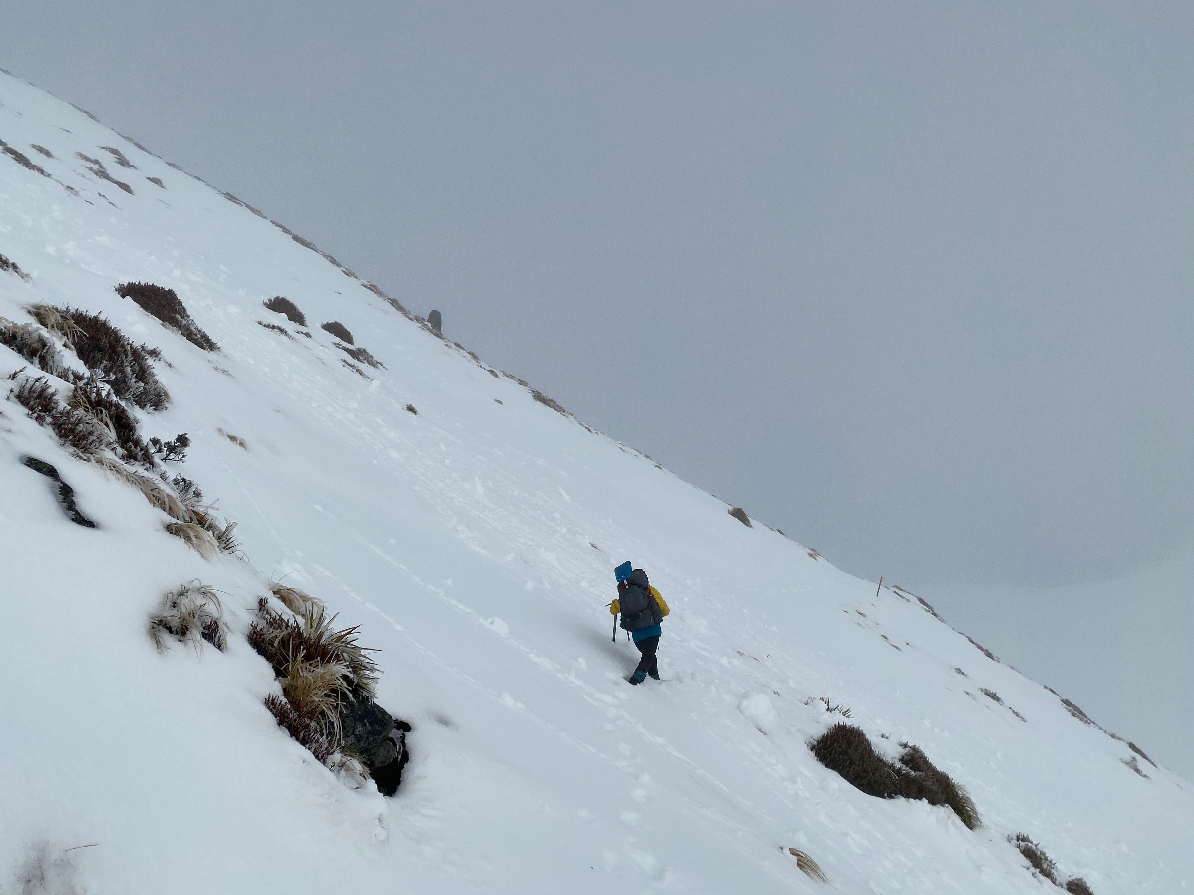 Jen passes through an area with surface snow tumbles.