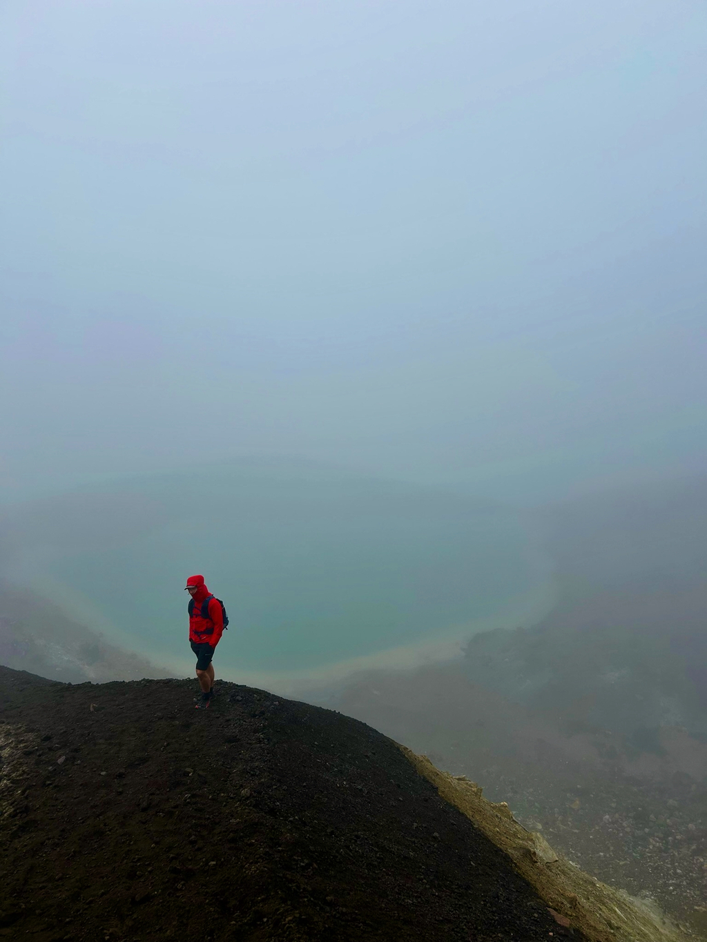 Me waiting for the others on the scree slope to the Emerald Lakes.