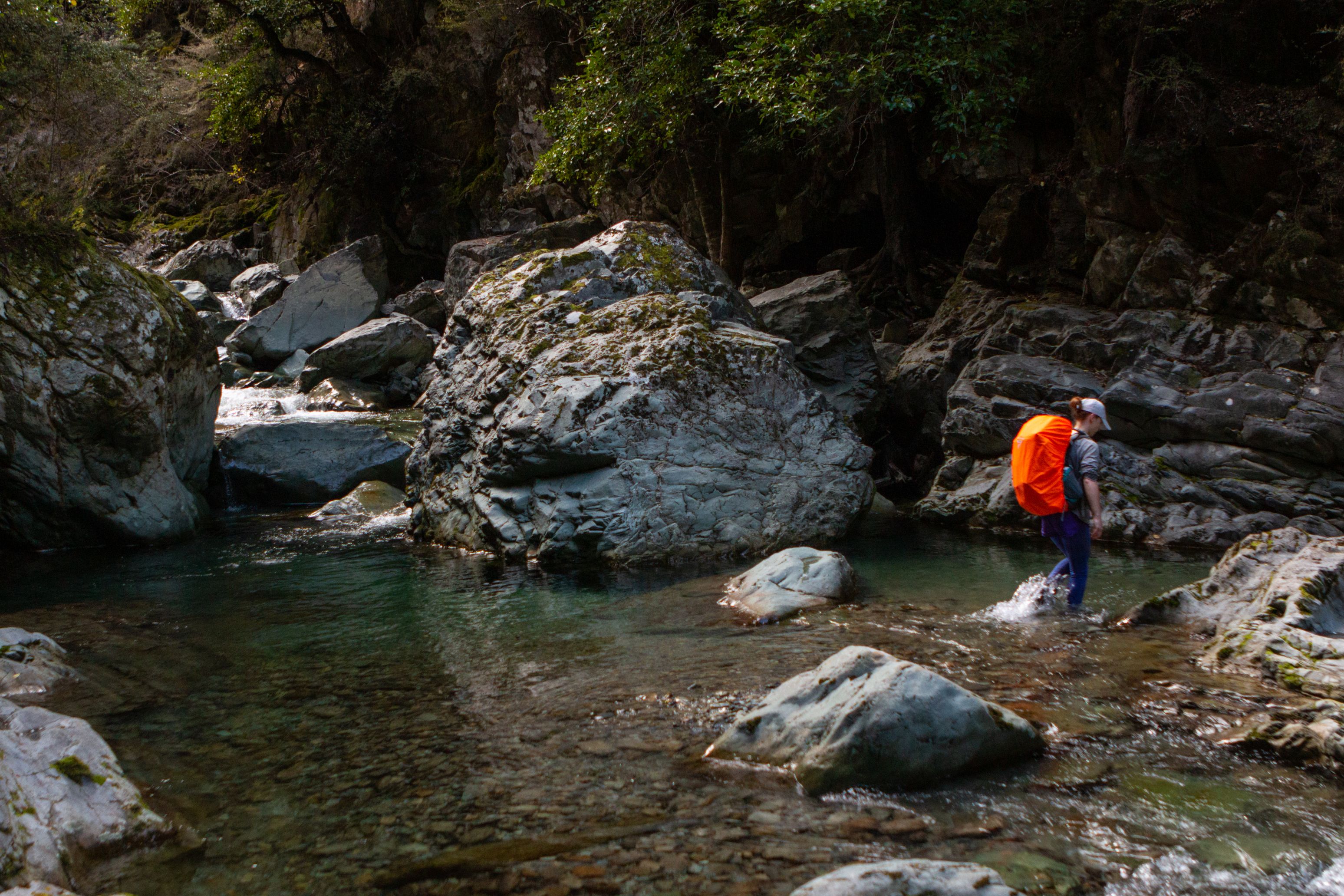 Jen crossing the confluence of streams just before Goulter River is formed.