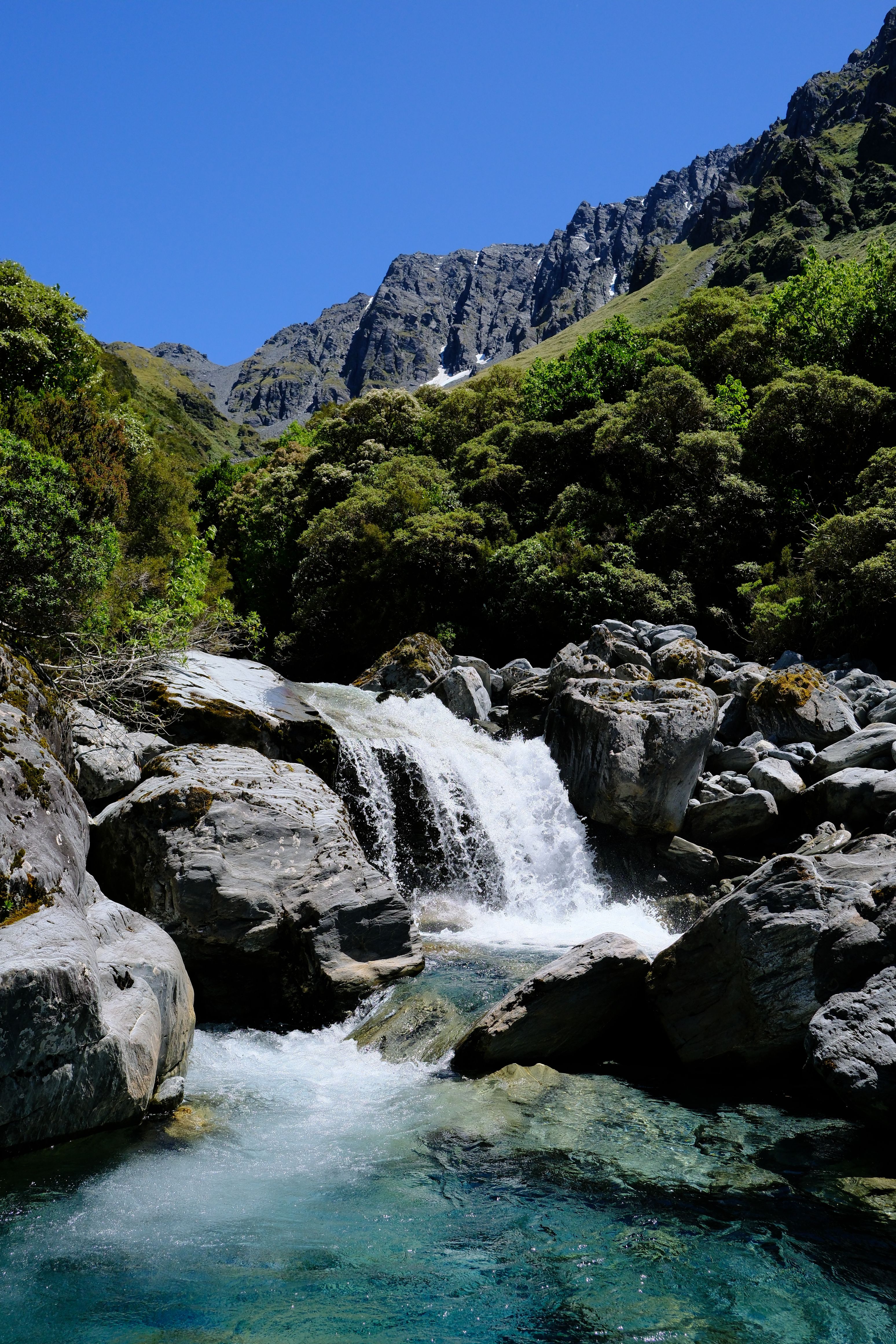 One of many beautiful waterfalls with bluffs on the side of Tara Tama in the background.